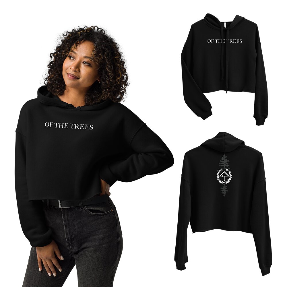 Of The Trees cropped hoodie for EDM festivals — black crop hoodie with OF THE TREES text front and pine tree emblem back